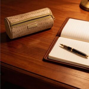 Oscar de la Renta Beige Cylinder Pouch with Gold Accents